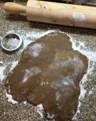 cookie dough rolled out on floured surface